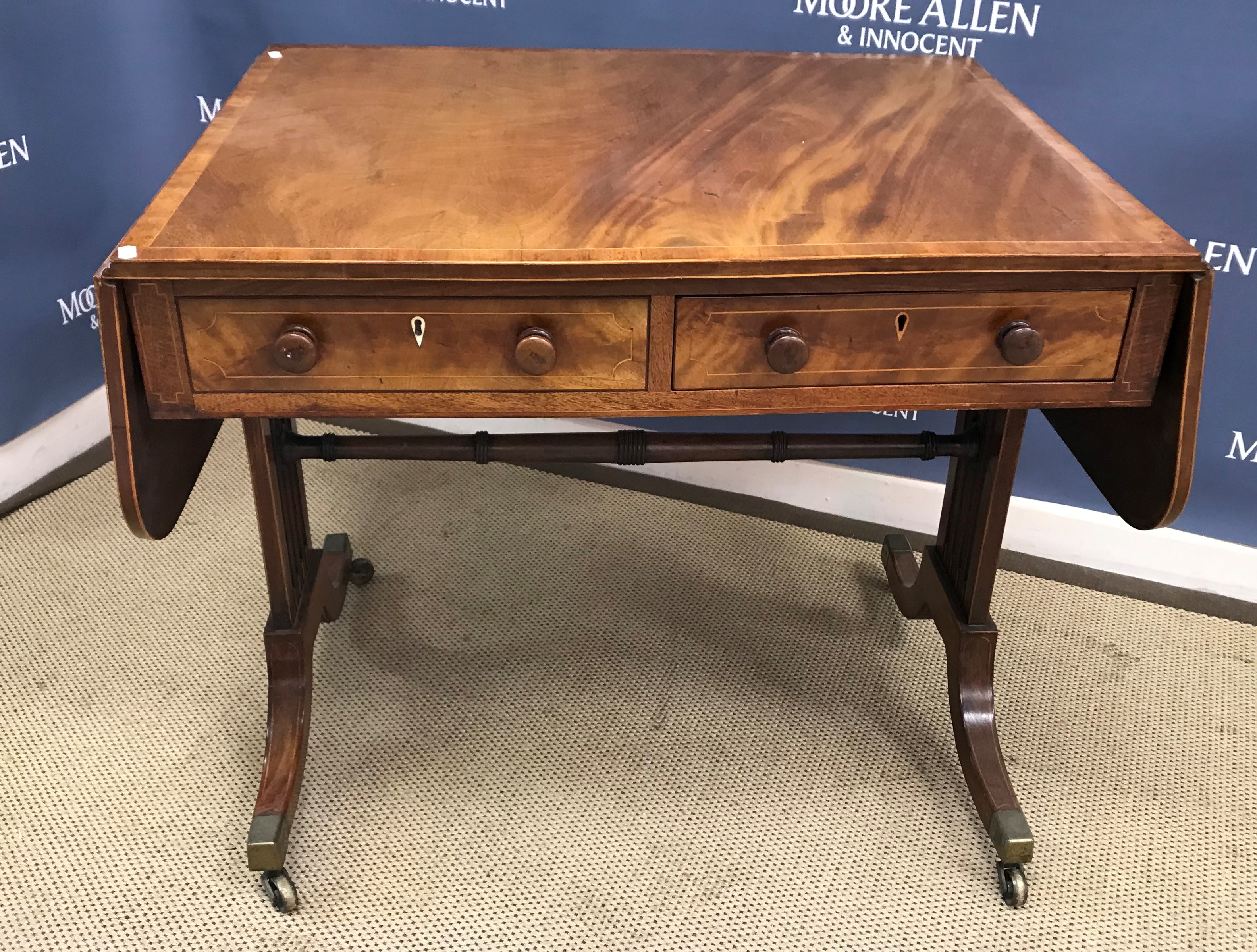 A 19th Century mahogany and inlaid drop-leaf sofa table,