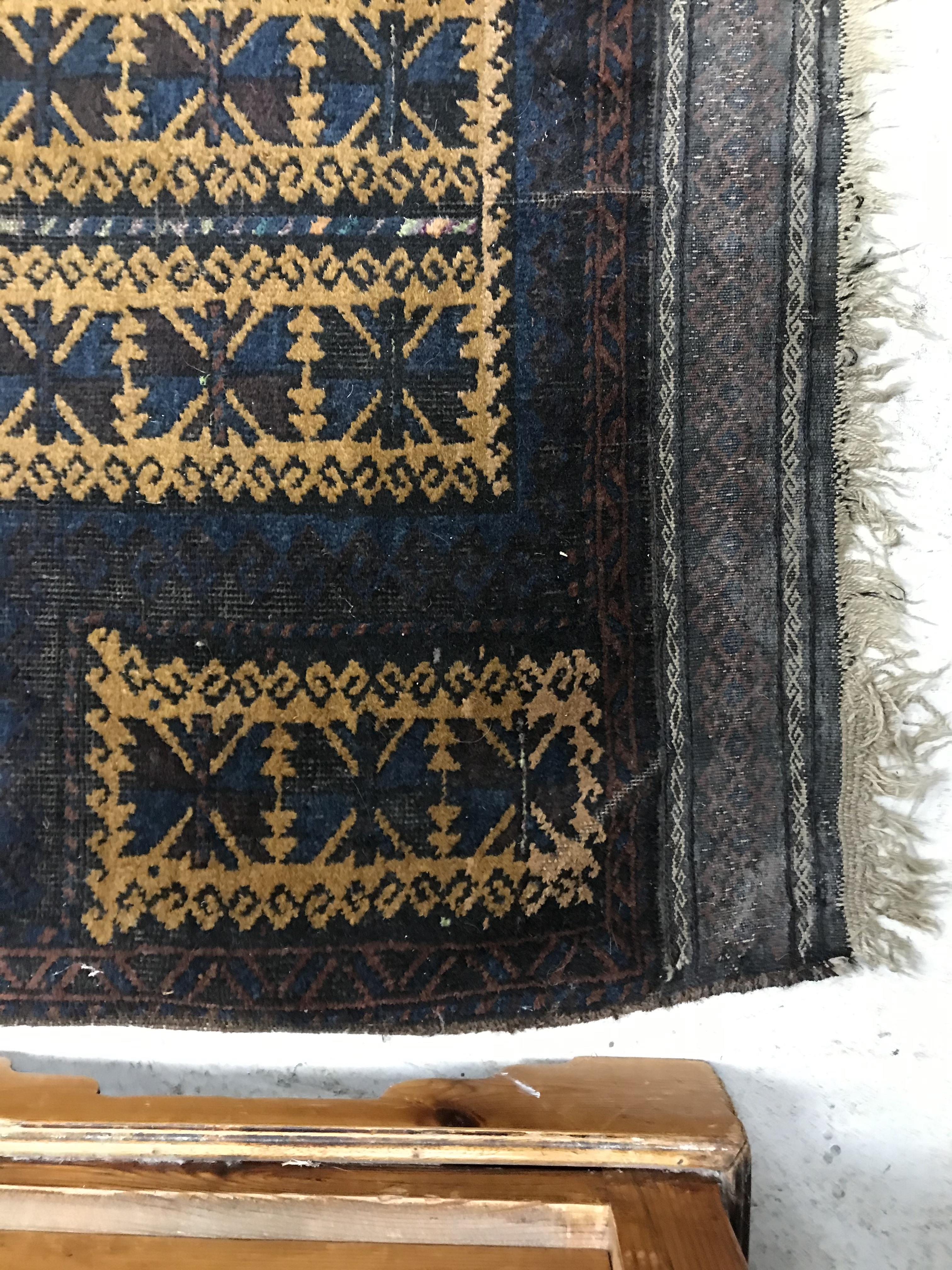 A Belouch prayer rug, the central panel set with geometric designs on a mustard ground, - Image 19 of 28