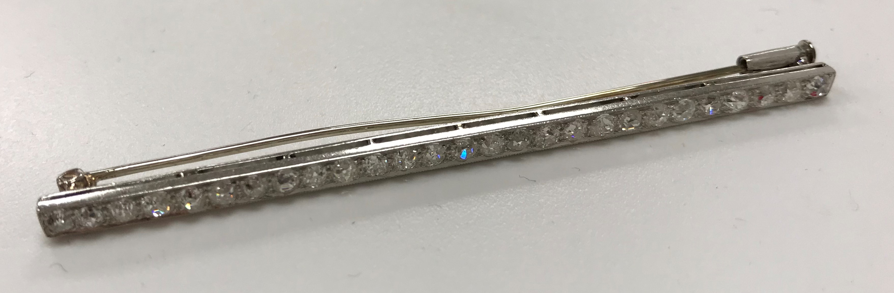 An early 20th Century white metal mounted old cut diamond set bar brooch with 27 stones approximate - Image 2 of 4