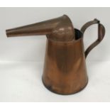 A copper water jug with unusual spout, 32 cm high,