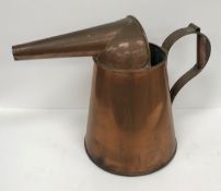 A copper water jug with unusual spout, 32 cm high,