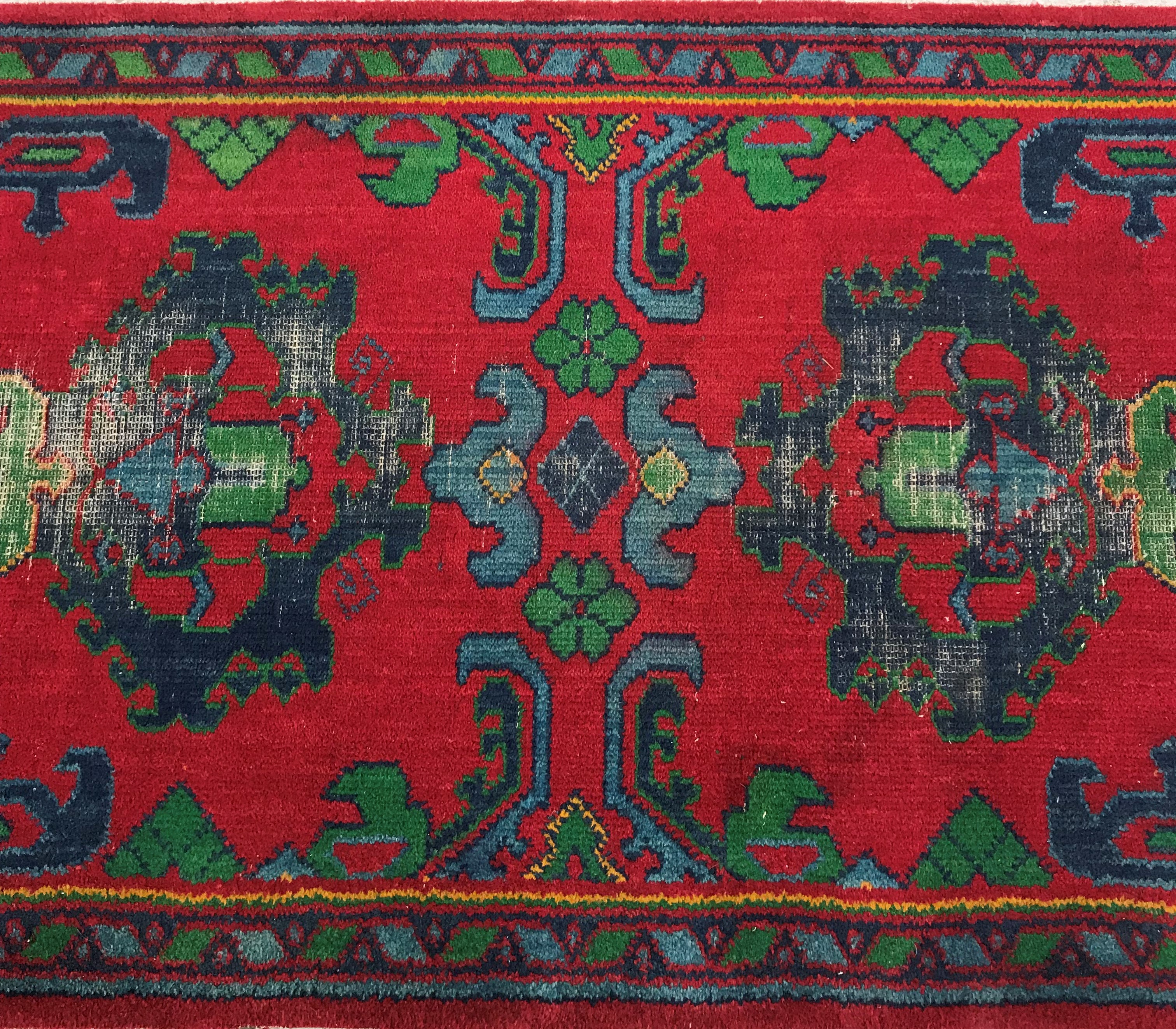 A Donegal type machine woven runner set with repeating geometric style design on a red ground, - Image 15 of 26