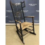 A black stained ash and beech rocking chair in the style of Ernest Gimson for Robert Weir Schultz