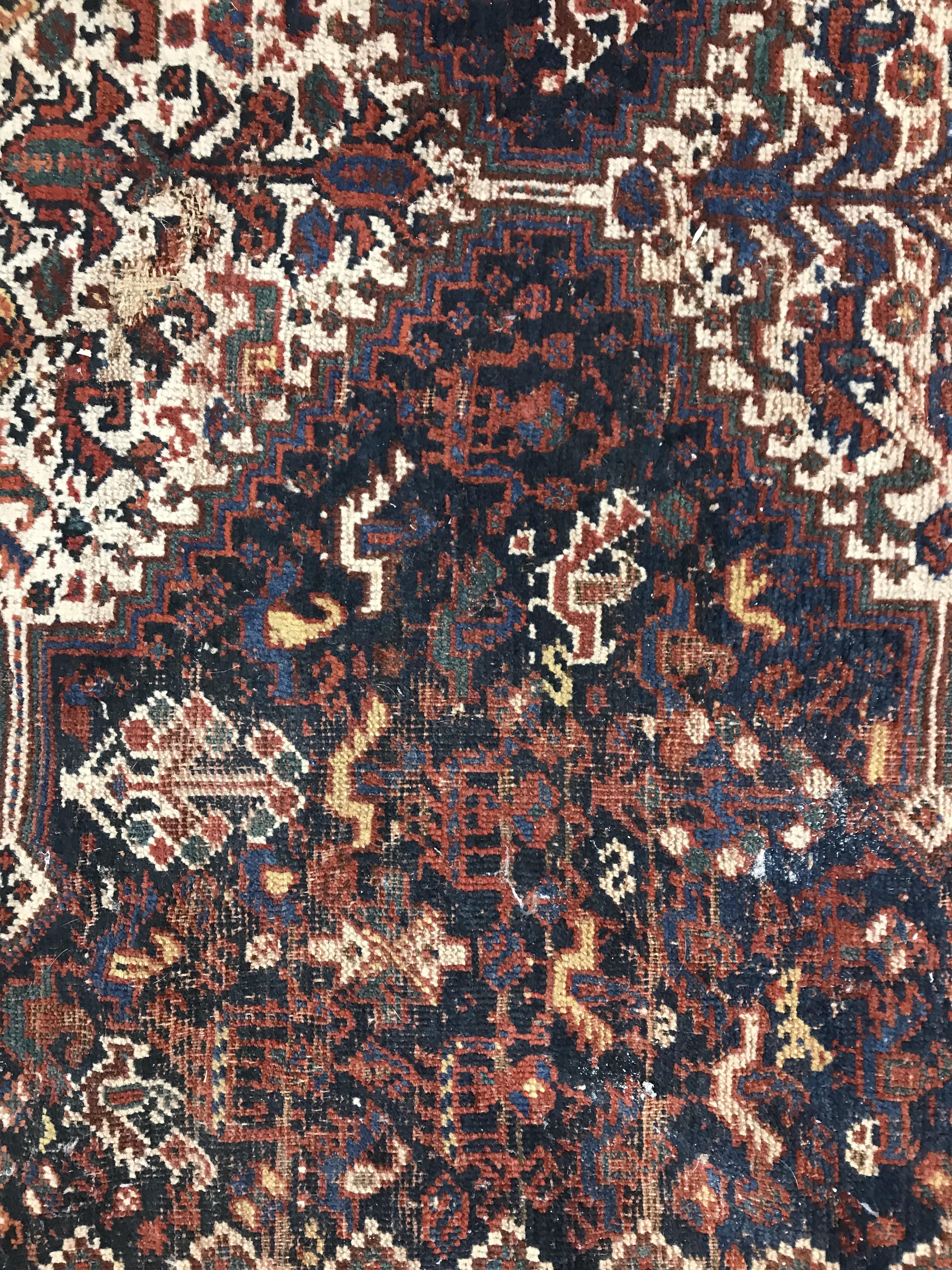 A Persian carpet, the central panel set with repeating medallions on a dark blue ground, - Image 28 of 93