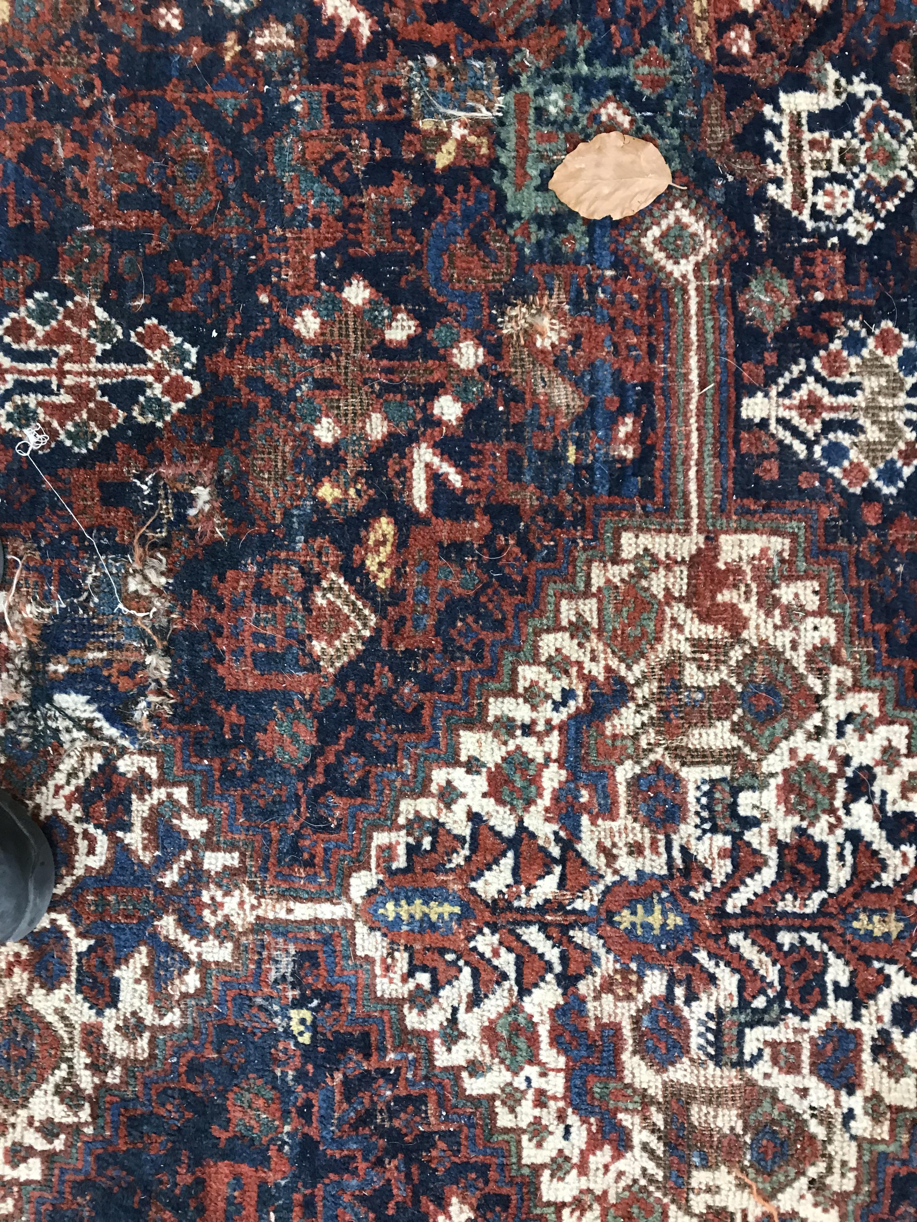 A Persian carpet, the central panel set with repeating medallions on a dark blue ground, - Image 21 of 93
