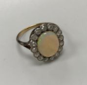 A yellow and white metal opal and diamond set dress cluster ring,