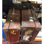 A vintage brown leather suitcase initialled "ASH" to front together with a further vintage leather