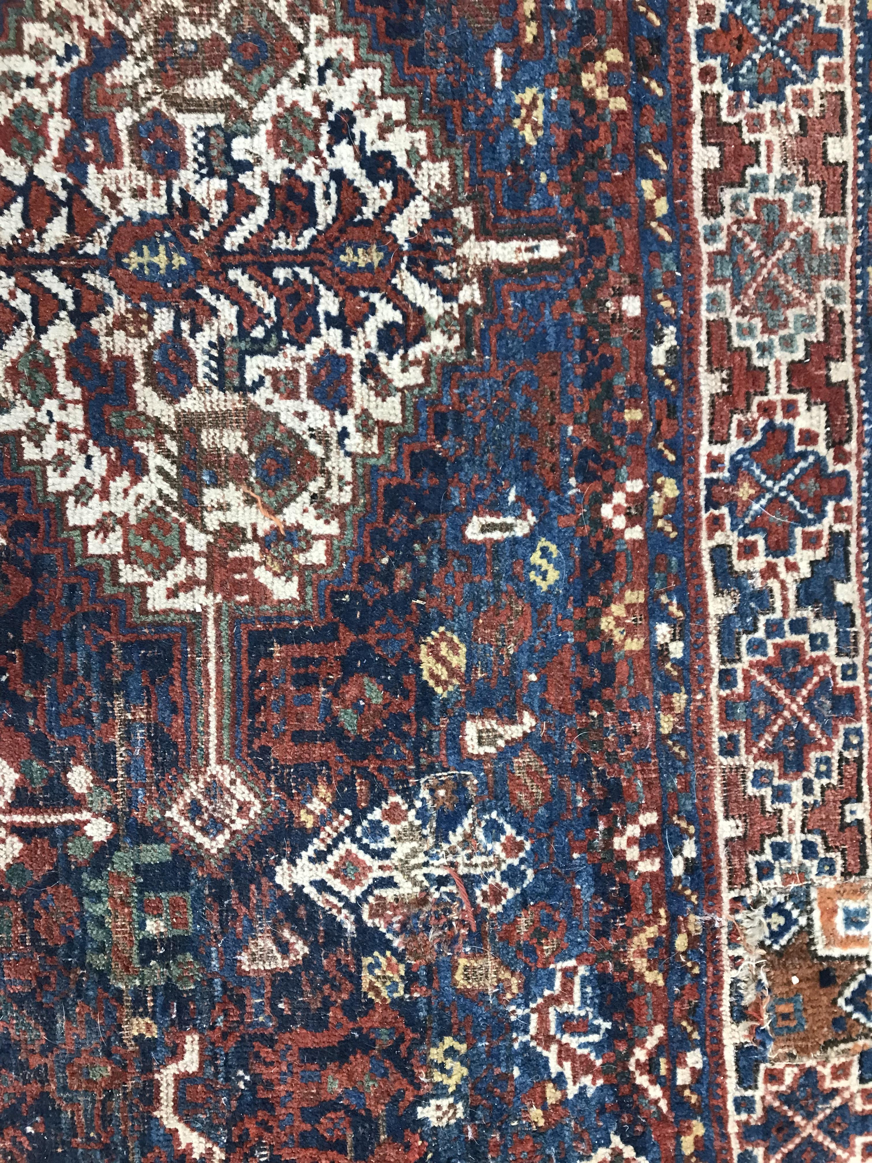 A Persian carpet, the central panel set with repeating medallions on a dark blue ground, - Image 17 of 93