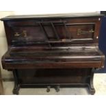 A circa 1900 mahogany cased upright piano, the wooden framed movement by R.W.