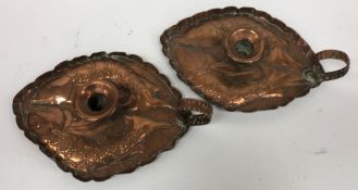 A pair of circa 1900 Arts & Crafts copper chambersticks of lozenge shape with embossed fish