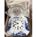An early 20th Century Dutch pottery wall clock with blue and white windmill decoration,