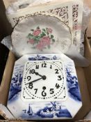 An early 20th Century Dutch pottery wall clock with blue and white windmill decoration,