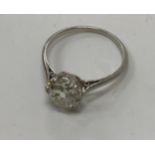 An early 20th Century platinum mounted mine cut diamond single stone ring,