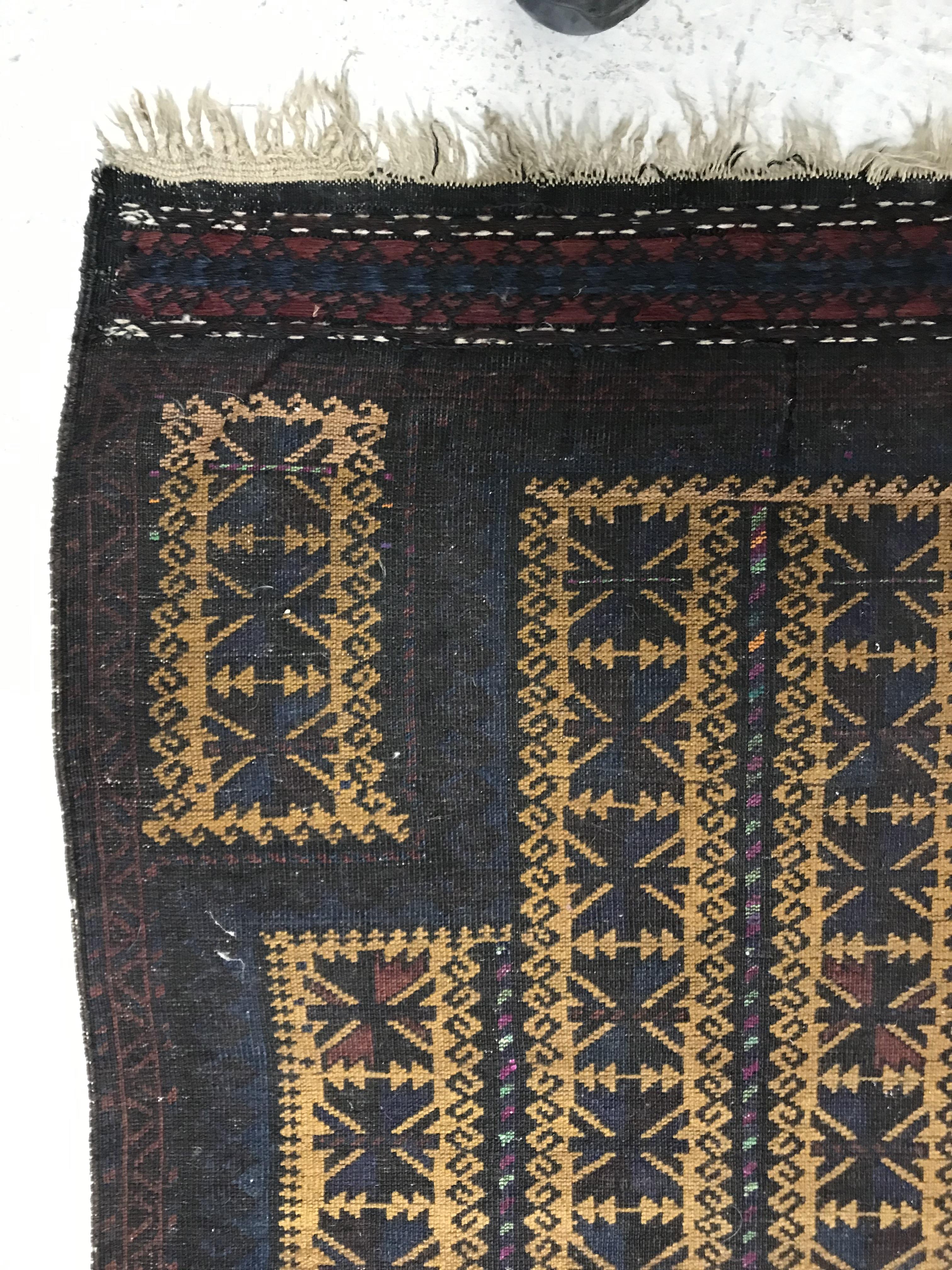 A Belouch prayer rug, the central panel set with geometric designs on a mustard ground, - Image 7 of 28