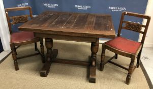 A mid 20th Century oak draw leaf dining table,