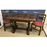 A mid 20th Century oak draw leaf dining table,