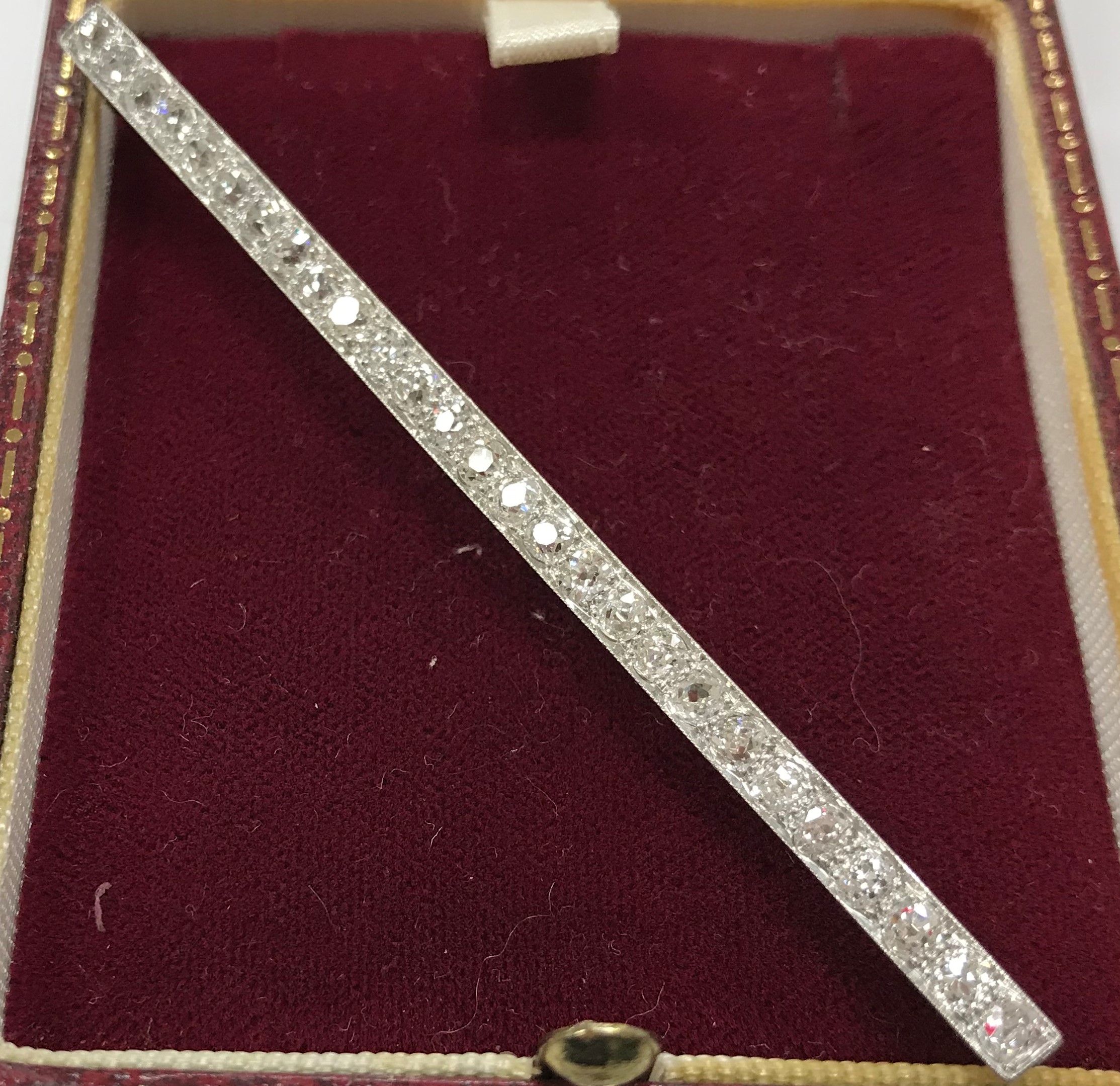 An early 20th Century white metal mounted old cut diamond set bar brooch with 27 stones approximate - Image 3 of 4