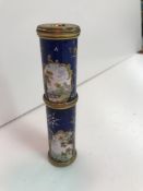 A 19th Century enamel decorated two section telescope with landscape and figural decoration opening