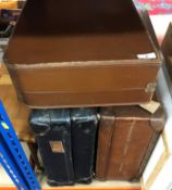 A collection of sundry items to include suitcases, cast iron fire basket, various clocks,