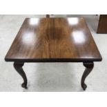 An early 20th Century mahogany rectangular extending dining table on cabriole legs to pad feet with