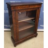 A mahogany side cabinet with single glazed door enclosing two shelves,
