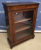A mahogany side cabinet with single glazed door enclosing two shelves,