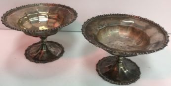 Two George V silver pedestal sweetmeat bowls with gadrooned edge raised on a central pedestal to
