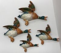 A set of four Beswick flying ducks No.