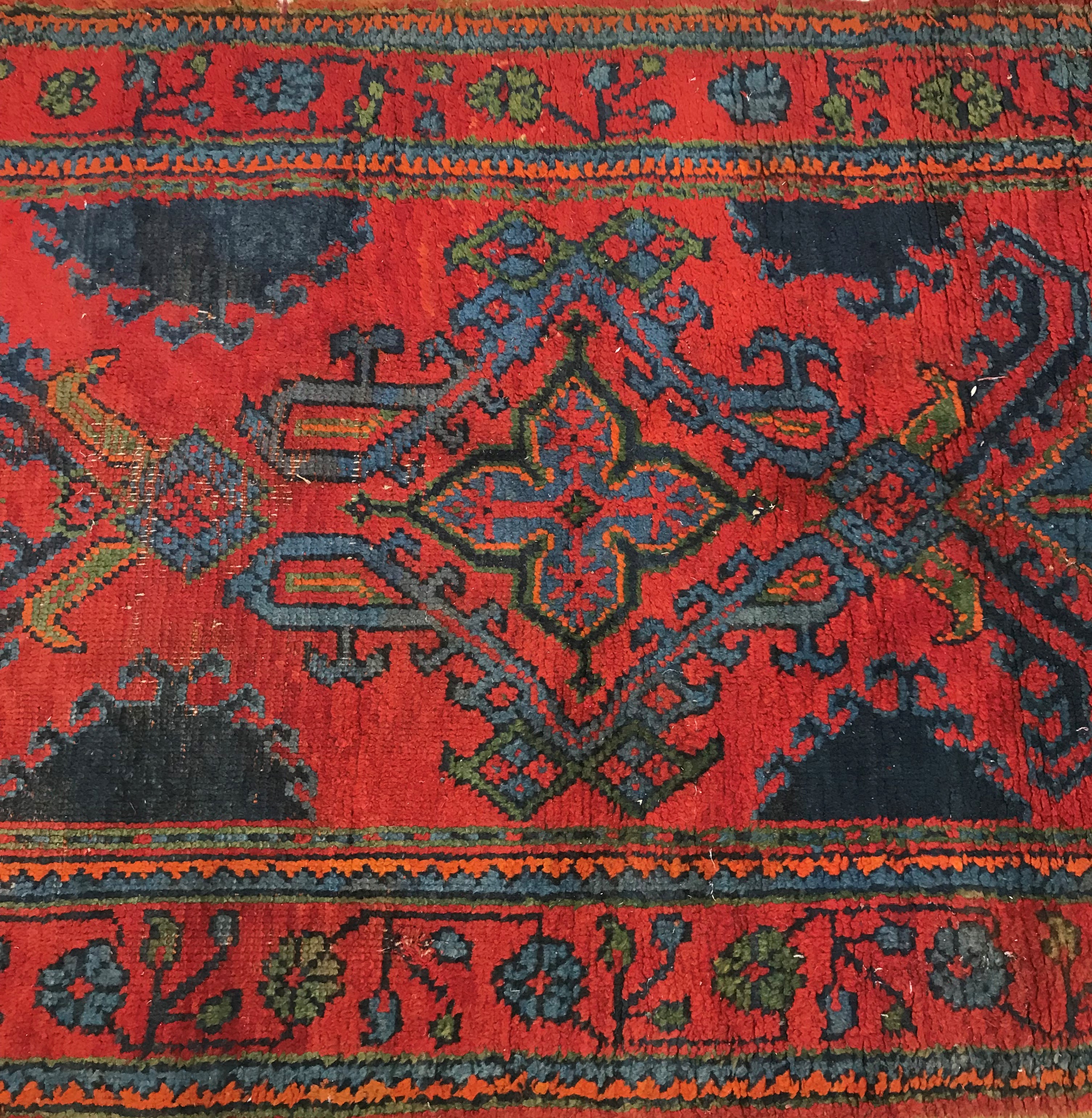 A Donegal style runner, the central panel set with repeating geometric designs on a red ground, - Image 4 of 7