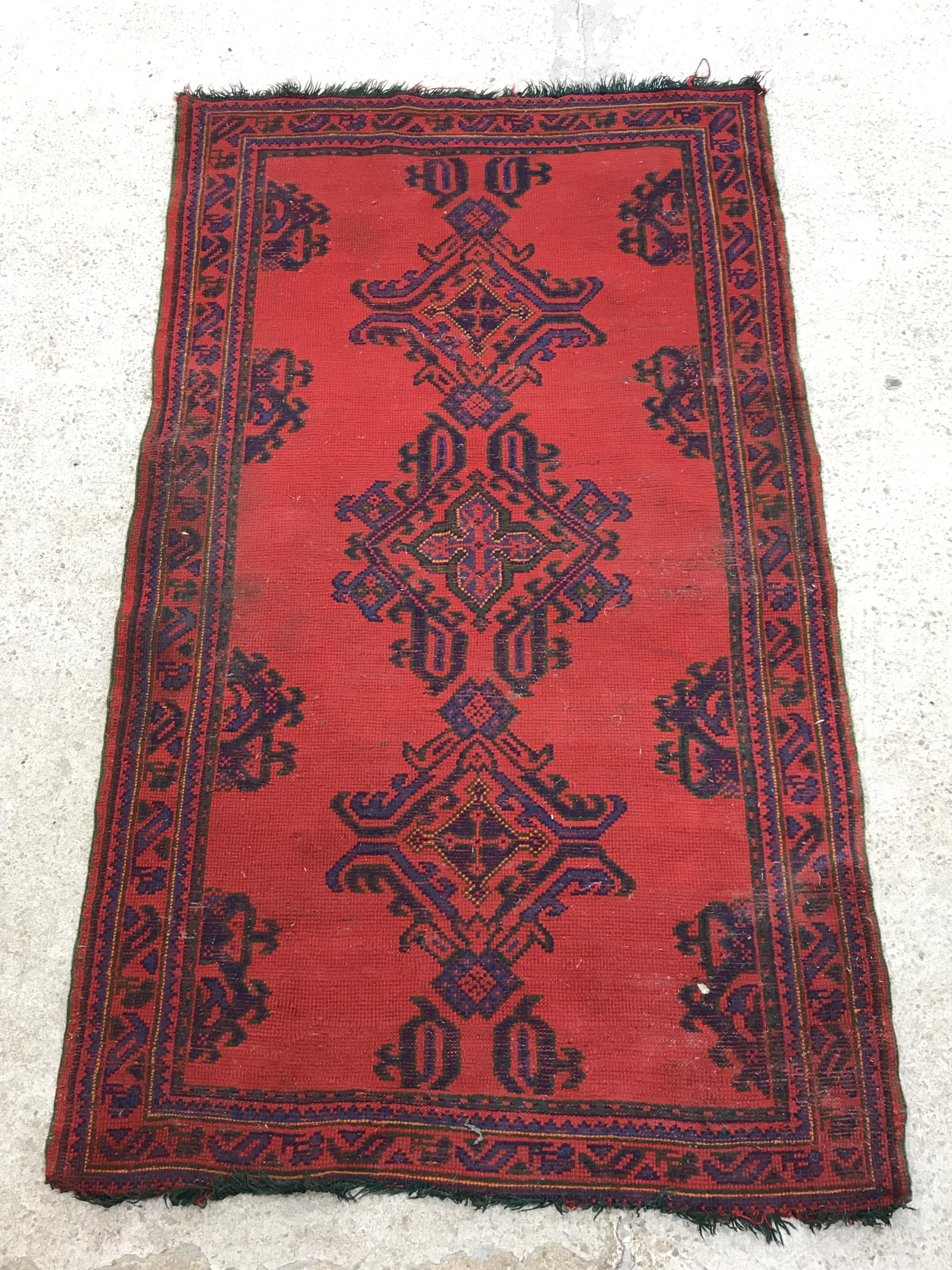 A Donegal style runner, the central panel set with repeating geometric design on a red ground, - Image 18 of 18