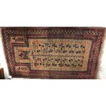 A vintage Belouch prayer rug, the central panel set with geometric design on a faun ground,
