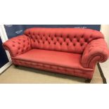 A circa 1900 Chesterfield sofa with button back and scroll arms,