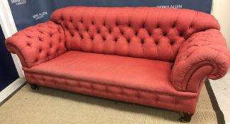 A circa 1900 Chesterfield sofa with button back and scroll arms,