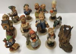 A collection of Goebal Hummel figures including "Happy days", "Home from market", "Soloist",