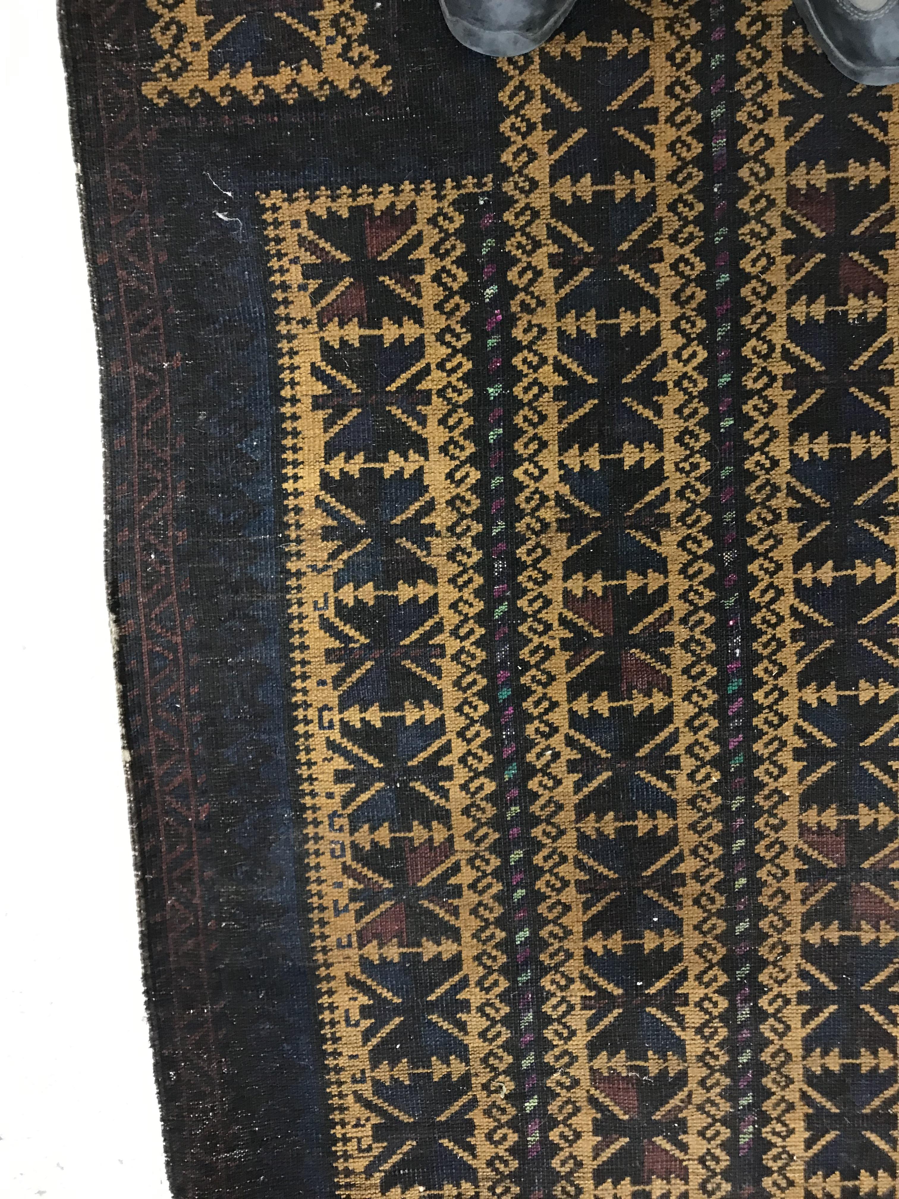 A Belouch prayer rug, the central panel set with geometric designs on a mustard ground, - Image 6 of 28