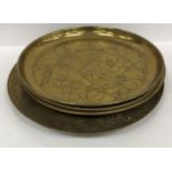 A collection of four brass trays, one in the Art Nouveau manner stamped "Made in England J.