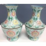 A pair of Chinese enamelled vases, the pale blue ground with floral decoration, 20.