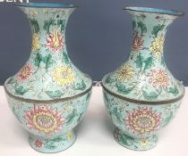 A pair of Chinese enamelled vases, the pale blue ground with floral decoration, 20.
