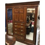 An Edwardian mahogany Sheraton Revival wardrobe compactum,