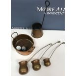 A collection of copper wares to include three cider measures, a set of measures inscribed "Whisky",