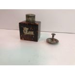 A tortoiseshell tea caddy with "Tea" inscribed in silver to the side and silver lid (by Cornelius