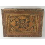 A straw work hinge-lidded box with stylised foliate and fruit decoration,