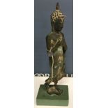 A Thai verdigris patinated bronze figure of a standing Buddha,