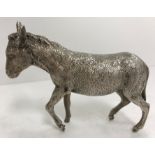 A silver model of a donkey (by Edward Barnard & Sons Ltd, London 1972) 6.