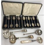 A collection of small silver wares to include a pair of Edwardian "Fiddle" pattern sauce ladles (by