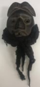 A West African “Dan” mask with real hair beard 23 cm long excluding hair