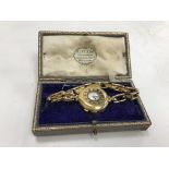 An 18 carat gold cased ladies "Half Hunter" type wristwatch,