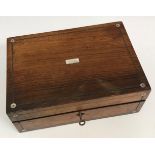 A Victorian mahogany and inlaid workbox opening to reveal various sewing accoutrements to include