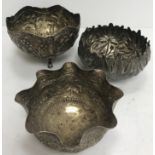 Three various Eastern white metal bowls, one with foliate embossed decoration,