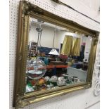 A modern rectangular gilt framed wall mirror with bevelled glass plate, 76 cm x 106 cm x 5.